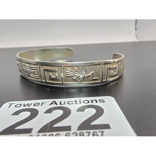 222 - A chunky 925 silver torque bangle having an Aztec South American design, is in good clean condition ... 