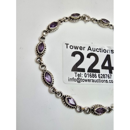 224 - A pretty 925 silver gemstone bracelet inset with faceted amethyst gemstones all the way around, in v... 