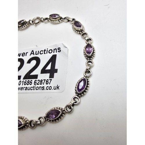 224 - A pretty 925 silver gemstone bracelet inset with faceted amethyst gemstones all the way around, in v... 