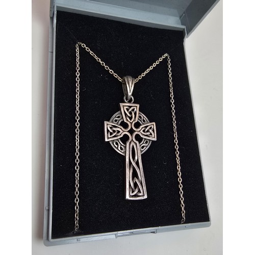 225 - An attractive 925 silver Celtic cross formed pendant with a pierced design stet on a 16