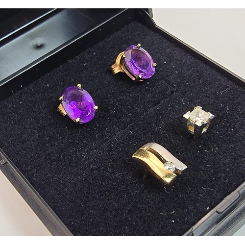 241A - A pair of pretty 9ct yellow gold stud earrings inset with vibrant purple amethyst gemstones along wi... 