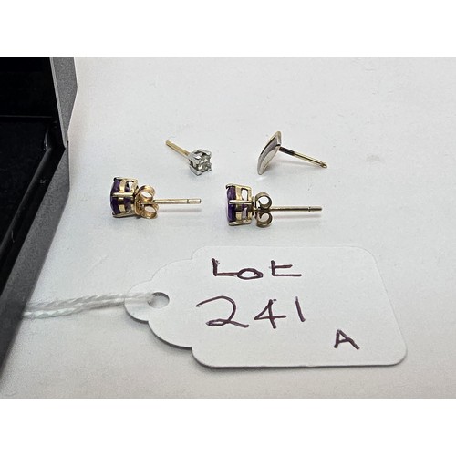 241A - A pair of pretty 9ct yellow gold stud earrings inset with vibrant purple amethyst gemstones along wi... 