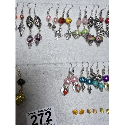 272 - A large bundle of approx 26 pairs of costume earrings all with interesting designs, some have art gl... 