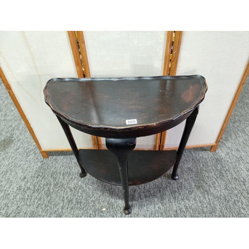 398 - Vintage demi lune hall table varnished in dark brown with shelf underneath in good overall condition... 