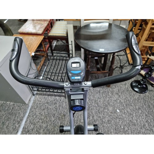 392 - Pro fitness exercise bike with digital display and touch keys to the handle bars in working order