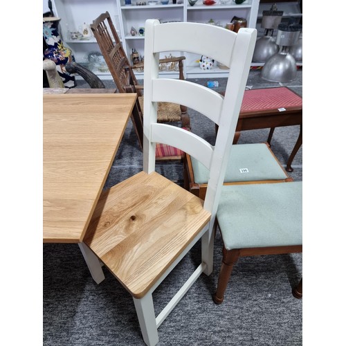 407 - Good quality modern cream and beech solid wood foldout dining table and two good quality solid chair... 