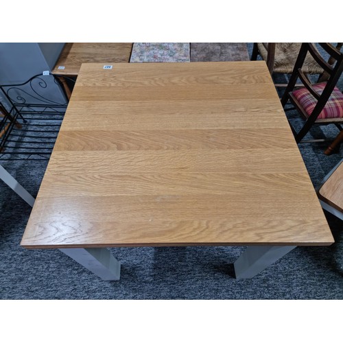 407 - Good quality modern cream and beech solid wood foldout dining table and two good quality solid chair... 