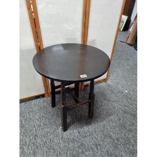 408 - Vintage circular topped pub table in oak, standing on four solid wood legs in overall good condition... 