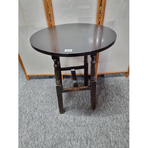 408 - Vintage circular topped pub table in oak, standing on four solid wood legs in overall good condition... 