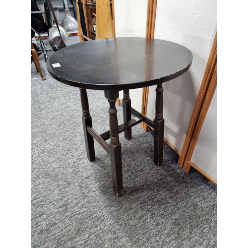 408 - Vintage circular topped pub table in oak, standing on four solid wood legs in overall good condition... 