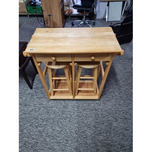 405 - Compact beech drop leaf table / breakfast bar in good order with two stools inside, table is on cast... 