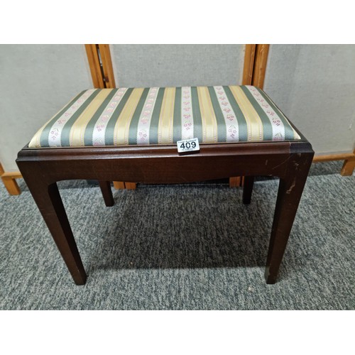 409 - Good quality mahogany piano stool with cushion top in striped floral design, in good order, has a he... 