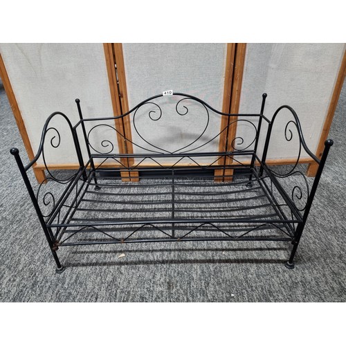 410 - Metal fold up dogs bed made of wrought iron in good order folds flat for ease of storage has a heigh... 