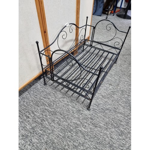 410 - Metal fold up dogs bed made of wrought iron in good order folds flat for ease of storage has a heigh... 