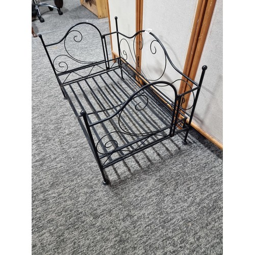 410 - Metal fold up dogs bed made of wrought iron in good order folds flat for ease of storage has a heigh... 