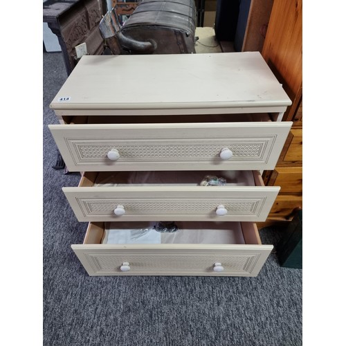 414 - Good quality cream coloured three drawer chest of drawers by Alstons Furniture, with lattice design ... 