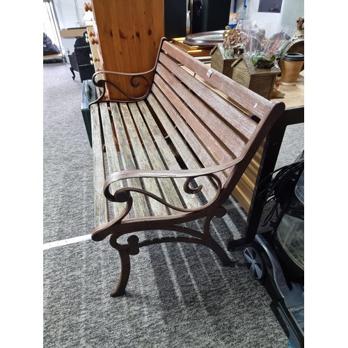 418 - Wrought iron and wood slat garden bench, missing its cross beam for stability, the wrought iron benc... 