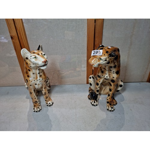 288 - A pair of tall impressive ceramic cheetah figures, both in a seated position and can be arrange to b... 