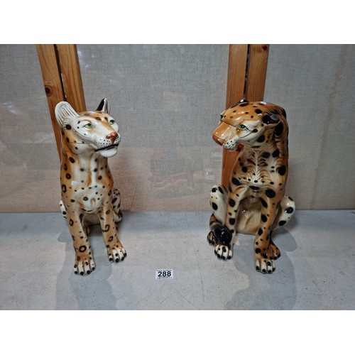 288 - A pair of tall impressive ceramic cheetah figures, both in a seated position and can be arrange to b... 