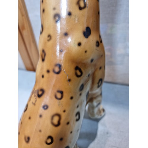 288 - A pair of tall impressive ceramic cheetah figures, both in a seated position and can be arrange to b... 