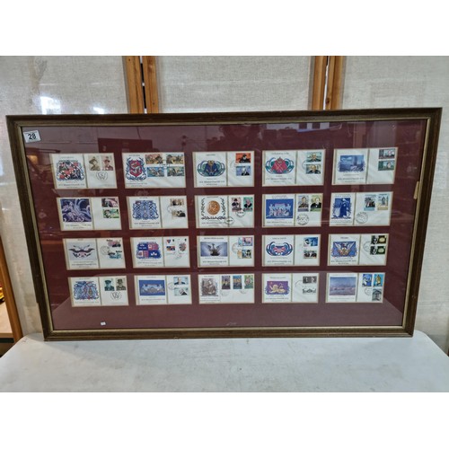 28 - Large framed and glazed set of First Edition First Day covers of the Winston Churchill stamp set con... 