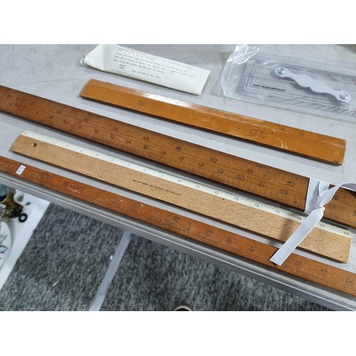 1 - Collection of draughtsmen / architect rulers to inc a large 120in ruler, a angled ruler 4x other add... 