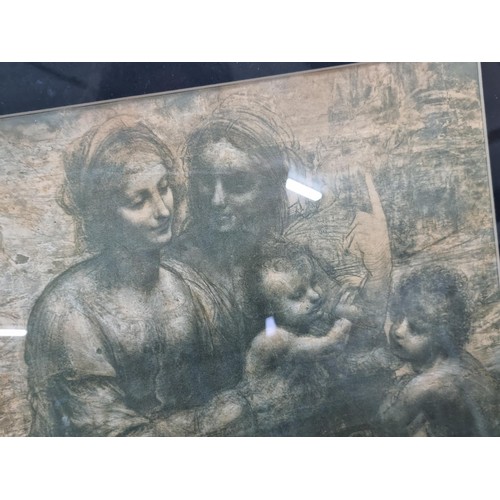 33 - Framed and glazed Leonardo da Vinci print depicting Virgin Child with St. John the Baptist and St. A... 