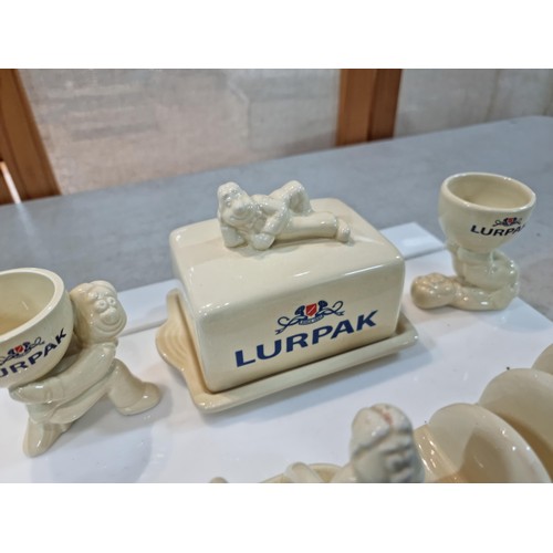 41 - Collection of 1980s Lurpak tableware to include 2x egg cups, 2x toast racks, and a butter dish. All ... 