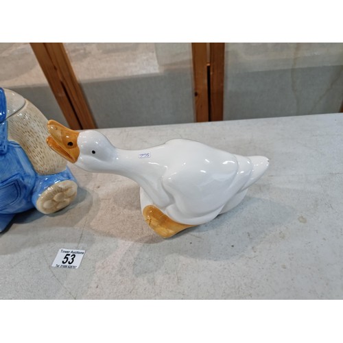 53 - Large teddy bear cookie jar in striking colours along with a ceramic goose, both have no chips or cr... 