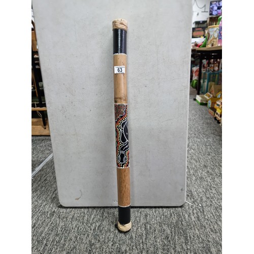 63 - Good quality fair trade rain stick with decorative turtle image to the side has a length of 80cm