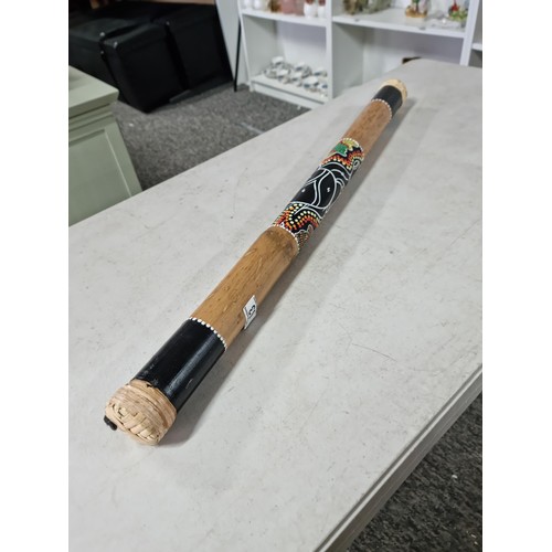 63 - Good quality fair trade rain stick with decorative turtle image to the side has a length of 80cm