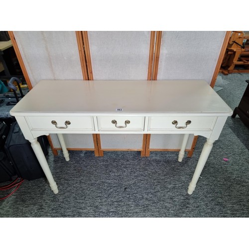 463 - Good quality genuine Laura Ashley cream painted console table with three drawers below the table is ... 