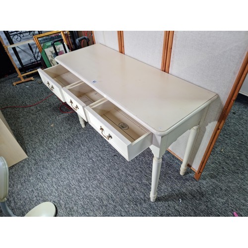 463 - Good quality genuine Laura Ashley cream painted console table with three drawers below the table is ... 