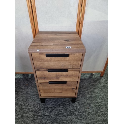 468 - Modern wooden three drawer bedside chest by NEXT in clean condition matches lot 457, has a height of... 