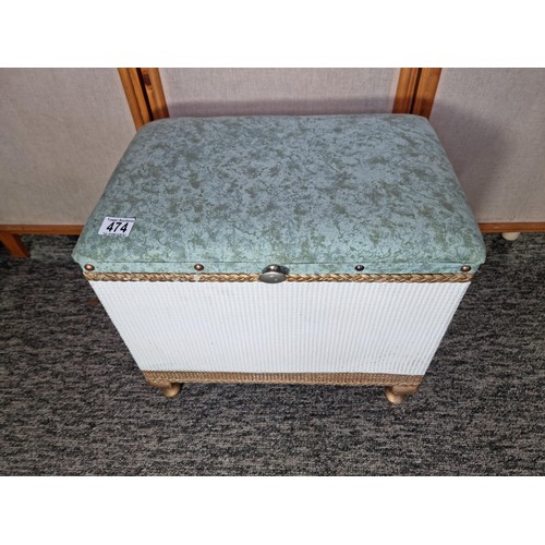 474 - Lloyd loom type linen storage stool with an upholstered cushion top in clean condition height 40cm l... 