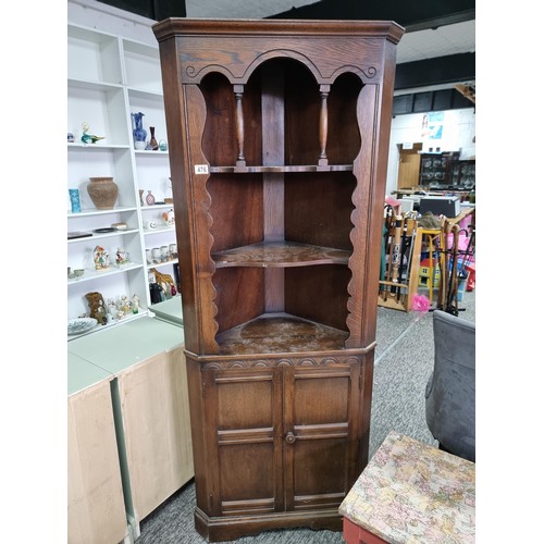 476 - Good quality vintage solid oak prior corner cabinet having three shelves with two doors below cabine... 