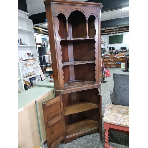 476 - Good quality vintage solid oak prior corner cabinet having three shelves with two doors below cabine... 