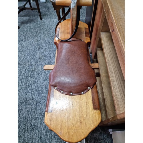 478 - Good quality vintage solid beech rocking horse with a rexine saddle which swings on a wooden cradle ... 