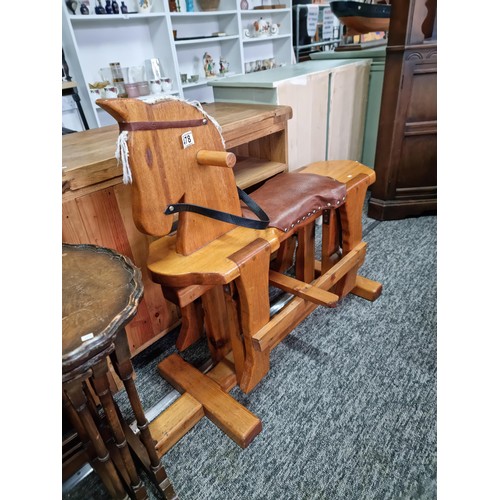 478 - Good quality vintage solid beech rocking horse with a rexine saddle which swings on a wooden cradle ... 