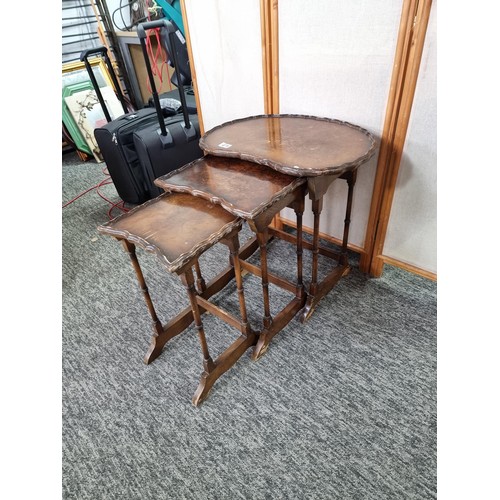 479 - Set of early vintage nest of three tables the top table has a kidney shaped top with piecrust edge t... 