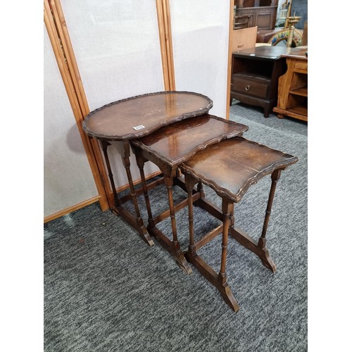 479 - Set of early vintage nest of three tables the top table has a kidney shaped top with piecrust edge t... 