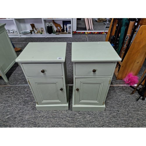 482 - Pair of clean and tidy light green painted bedside cabinets having door below one drawer with brass ... 