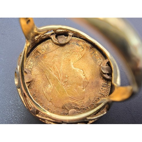 258 - An impressive gold sovereign ring featuring a 9ct gold ring inset with a genuine 