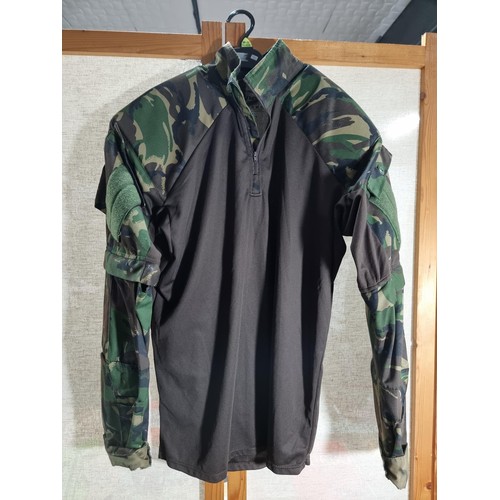 111 - Good quality X-Large camouflage army training top in good order with padded shoulders.