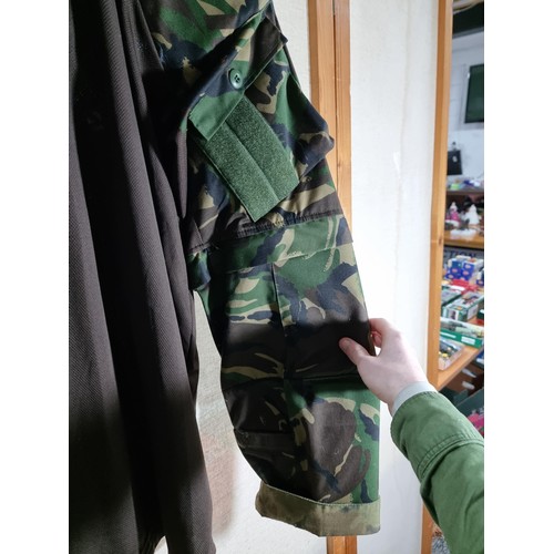 111 - Good quality X-Large camouflage army training top in good order with padded shoulders.