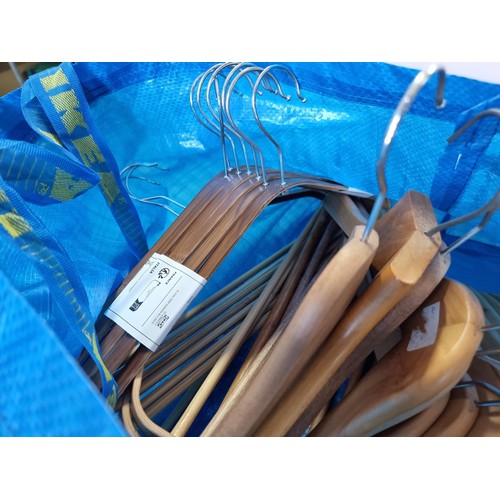 15 - Ikea bag containing a large quantity of as new wooden Ikea coat hangers, 35x in total to include 4x ... 