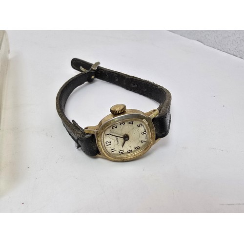 213 - A vintage Timex ladies wristwatch complete with its original box, outer box and paperwork, the guara... 