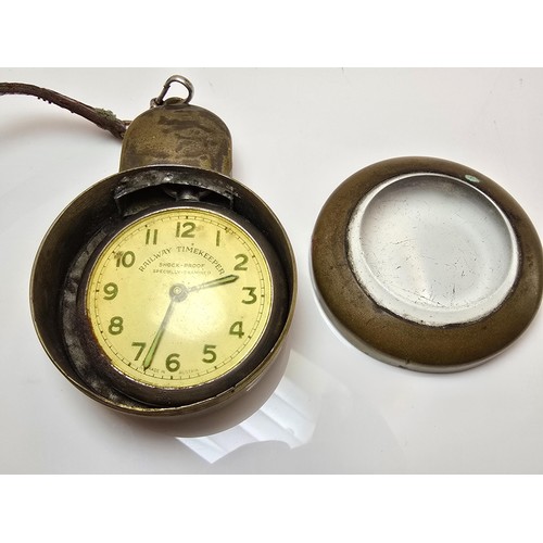 219 - A good vintage heavy duty brass miners pocket watch case complete with a railway timekeeper vintage ... 