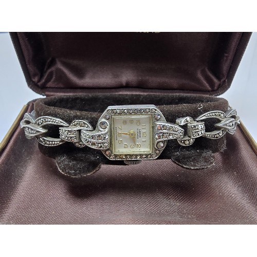 221 - A good quality vintage 1960's sterling silver ladies watch with an ornate design inset with marcasit... 