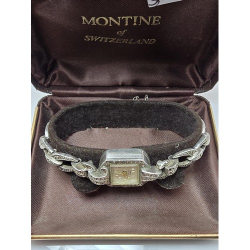 221 - A good quality vintage 1960's sterling silver ladies watch with an ornate design inset with marcasit... 